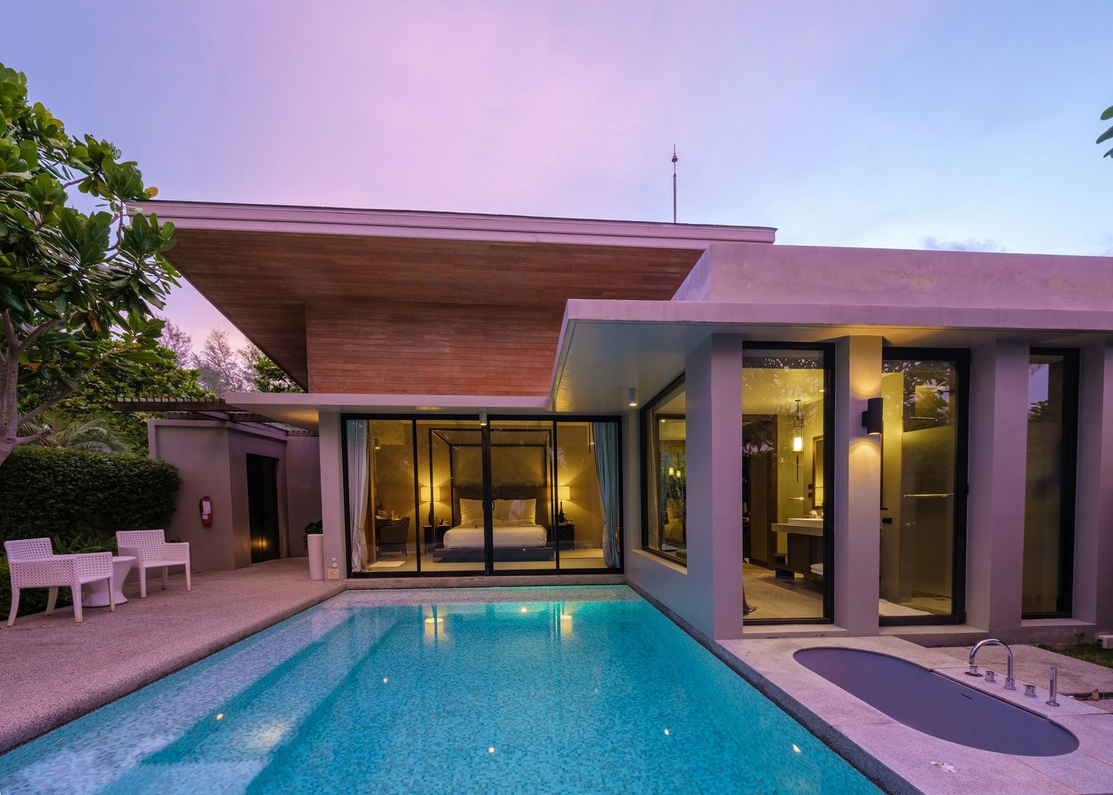 Modern house with a swimming pool, modern pool villa at the beach